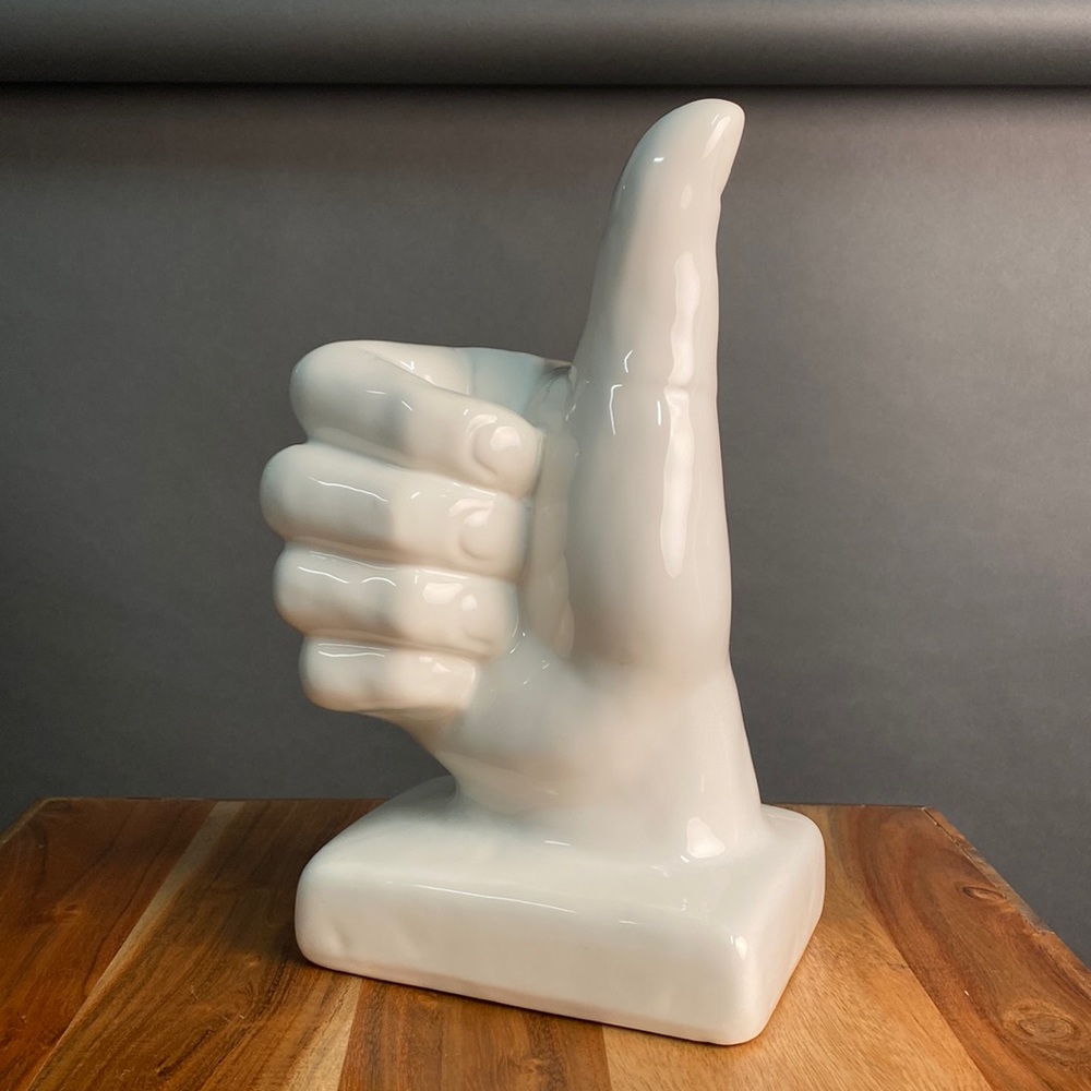 Thumps up statue